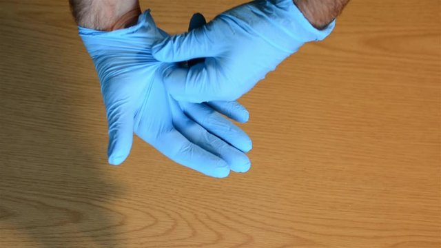 Technique For Removing Surgical Gloves To Avoid Contact With The Skin Of The Coronavirus Covid-19 