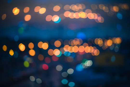 Abstract blur defocused night bokeh light in urban background. © ParinPIX