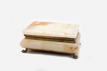  Traditional jewelry box made of marble stone with close head on white background.