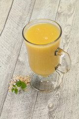 Dietary vegetarian oats milk over wooden