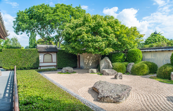 The beautiful Japanese rock garden in Hamilton, New Zealand. Rock garden is a type of garden which suggests mountains and water using only stones, sand or gravel and, occasionally, plants.