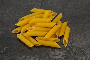 Raw penne pasta for bowl