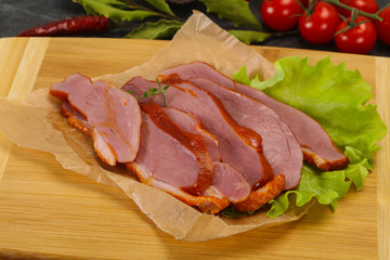 Sliced smoked duck breast served salad
