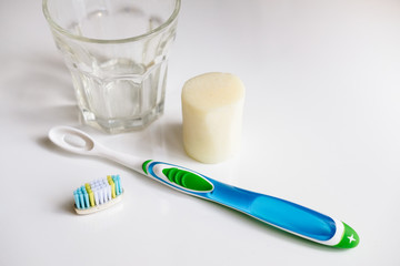 Zero waste solutions : removable head toothbrush, solid toothpaste and a glass.