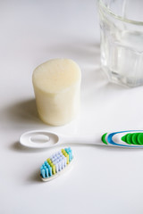 Zero waste solutions : removable head toothbrush, solid toothpaste and a glass.