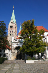 The great catholic Cathedral in Augsburg, Swabia, Bavaria, Germany in bright sunshine, blue sky and...