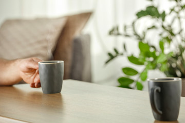 desk of free space and blurred home interior with window space 