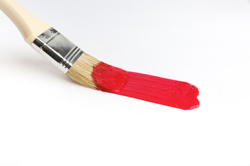 red brush stroke on white background