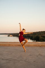 Fototapeta na wymiar girl dancer while dancing in the summer outdoors