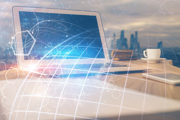 Multi exposure of table with computer and world map hologram. International data network concept.