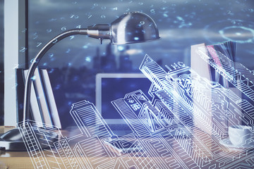 Desktop computer background in office and big town buildings hologram drawing. Double exposure. Smart city concept.