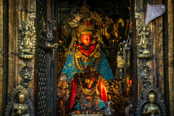 The beautiful ancient Buddha statue with red masked in Buddhist shrine in Kathmandu the capital cities of Nepal.