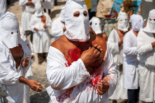 hooded men (battenti) beat their chest with a sponge with a nail, losing blood during septennial rites of penance, rituals in honor of Our Lady in Guardia Sanframondi, Benevento, Italy