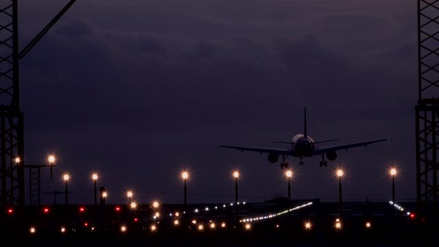 Manchester airport passenger jet landing in evening UK 4K
