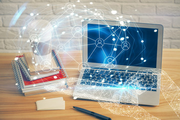 Computer on desktop with social network theme icon. Multi exposure. Concept of international connections.