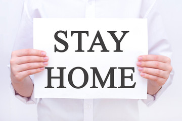 inscription Stay home. on a piece of paper in the hands of a man, a doctor. Coronavirus, Pandemic, Stay Home, Stay Safe