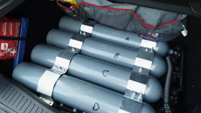 Close up of the methanol tank in car bootin a small, radio-controlled car, green energy