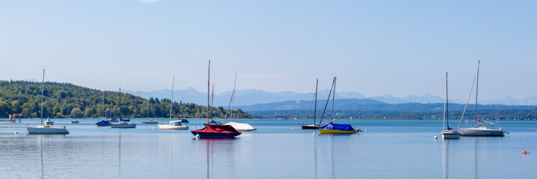 Panorama view of Lake Ammersee with anchoring sailboats
