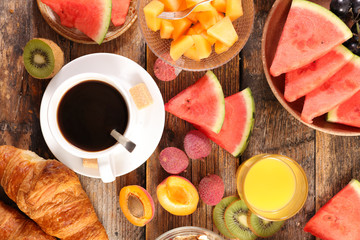 Fototapeta na wymiar coffee cup with fresh fruit- healthy breakfast