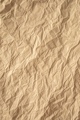 Fototapeta premium Brown crumpled paper close up texture background Vertical