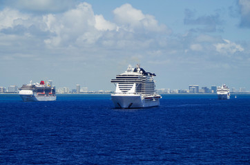 Cruiseships or cruise ship liners parked or anchored or laid up at sea in Miami Beach Florida due...