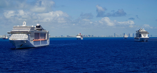 Cruiseships or cruise ship liners parked or anchored or laid up at sea in Miami Beach Florida due...