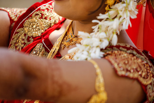 Indian wedding ceremony : bangle in bridal hand with mehandi design