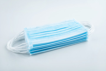 Disposable medical mask on white background