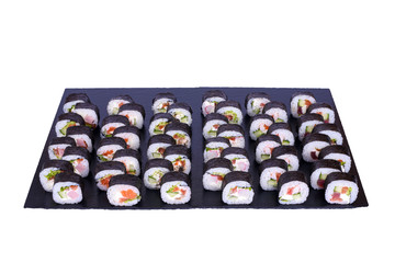 Maki Sushi set Futomaki rolls with fresh ingredients. Rolls on black stone isolated on white background. Sushi menu. Japanese food.