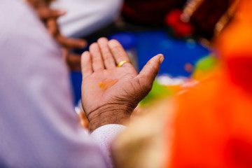 Fototapeta premium Traditional indian wedding ceremony, groom hand