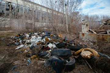 Pile garbage on junk in abandoned industrial area