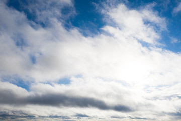 Obraz premium Aerial view white clouds in blue sky. View from drone. Aerial top view cloudscape. Texture of clouds. View from above. Sunrise or sunset over clouds. Panorama clouds