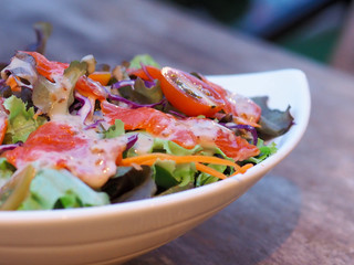 Fresh salmon salad with fresh vegetables Blurry background to make the subject stand out