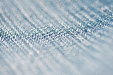 Jeans denim texture close up , focus only one point , soft blured background wallpaper