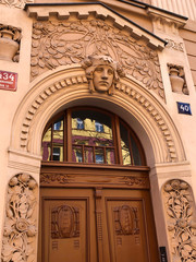 Obraz premium Pastel orange art nouveau building facade in Europe
