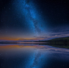 Mystical lake in starry night.