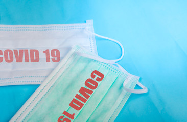 Anti virus protection mask standard to prevent corona COVID-19 flu, dust on a blue background...