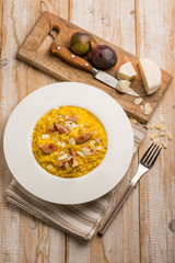 milanese risotto with cheese fig and sliced almond