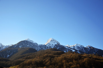 Fototapeta na wymiar snow-capped mountains in the sky