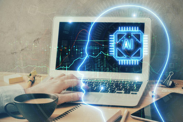 Businessman with computer background with brain theme hologram. Concept of brainstorm. Multi exposure.