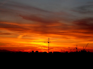 construction crane on the background of the sunset