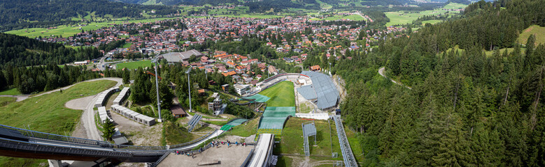 Fototapeta premium View from the Ski jumping stadium. Erdinger Arena. Oberstdorf, Bavaria, Germany. Resort, sport.