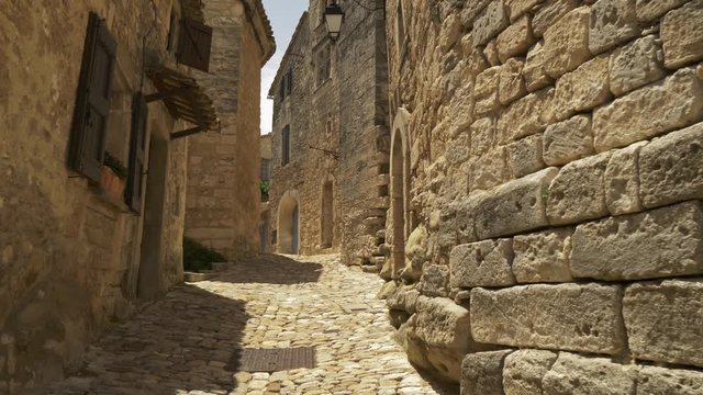 Walking alone on empty street of Lacoste ancient village. Provence, France. No people, coronavirus effects