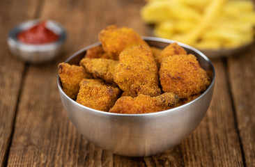 Homemade Chicken Nuggets on vintage background