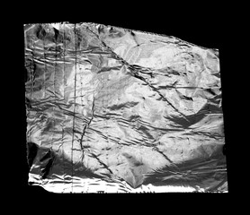 A piece of aluminum foil isolated on black background. Wrinkled aluminum foil.