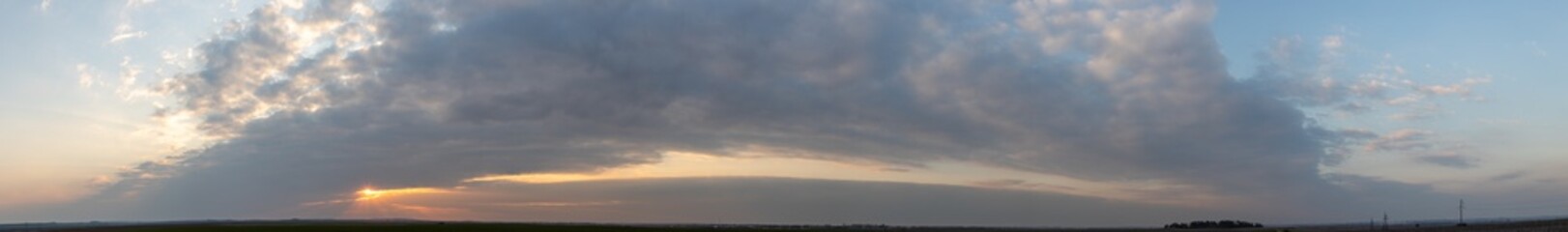 Panorama of clouds at sunset.