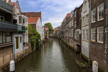 Water canal between houses in the city of Dordrecht in Holland.
