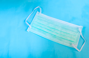 Anti virus protection mask standard to prevent corona COVID-19 flu, dust on a blue background...