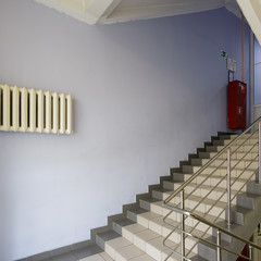 The interior staircase between floors in high-rise building