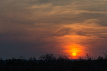 Fototapeta na wymiar Evening nature with scenic sunset sky against orange clouds background in Croatia.